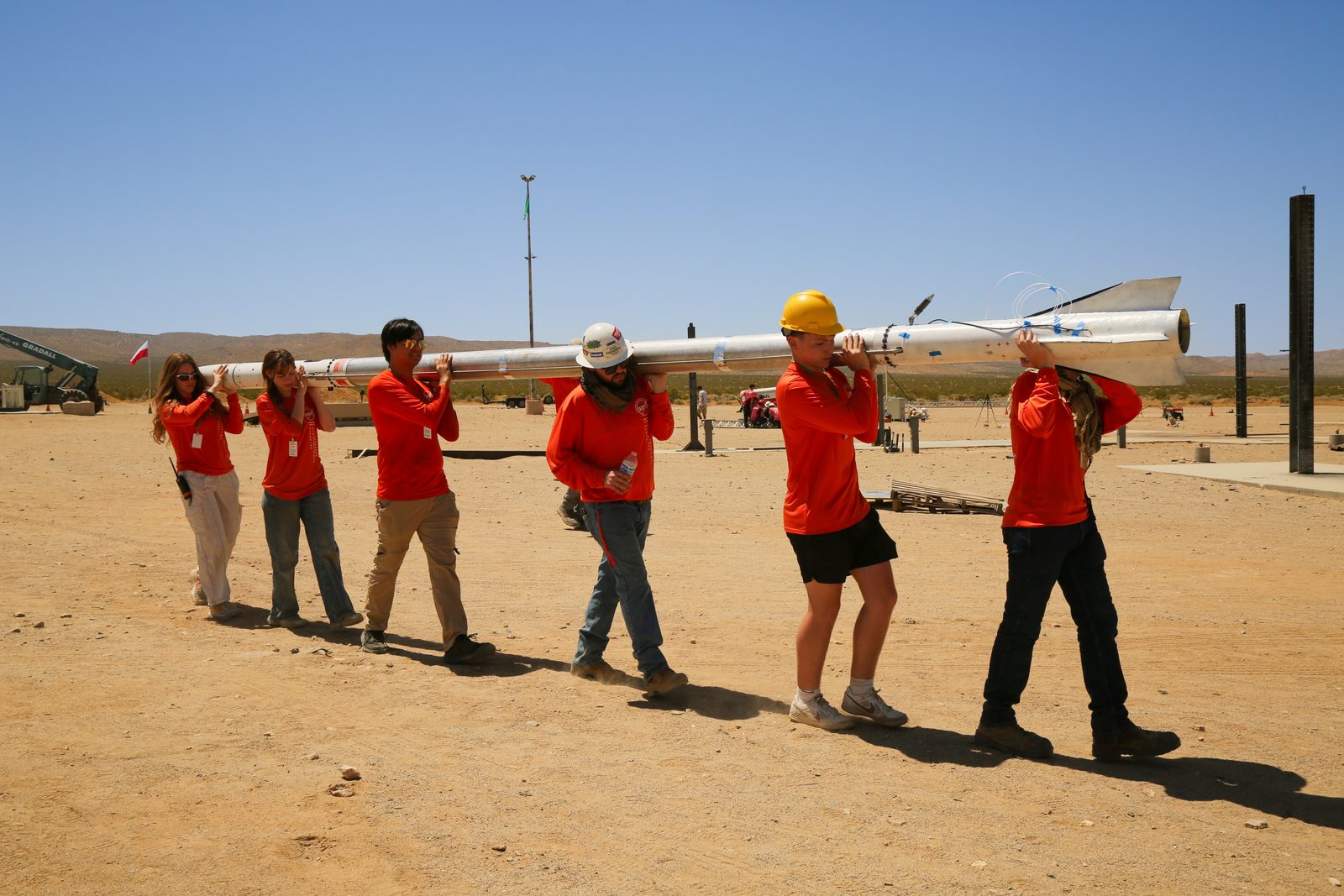 Students assembling a rocket airframe